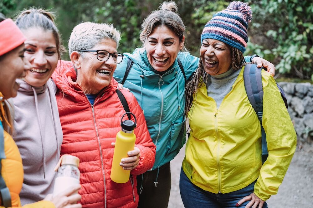 A group of senior women go for a walk around the Canton senior living community