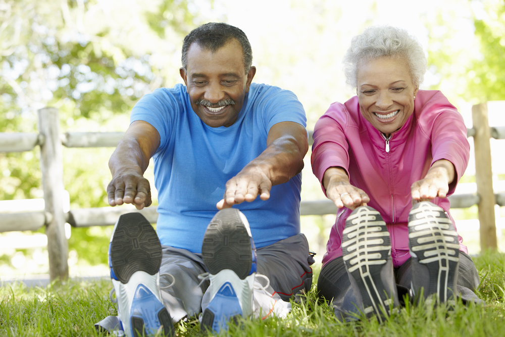 A senior couple stretches and exercises together at Canton senior living