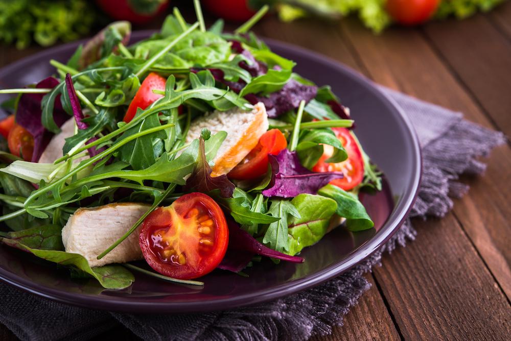 A fresh, healthy chicken salad served on a plate