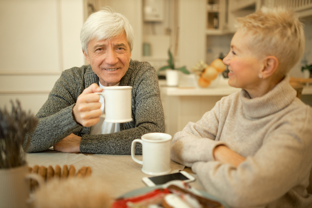 A senior man drinks tea at the Canton senior living homes