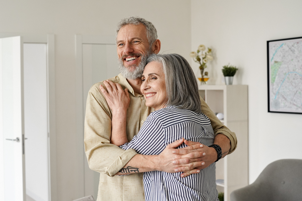 happy senior couple embracing and enjoying live at Kingsley