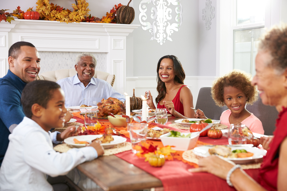 A senior couple enjoying a holiday dinner with family