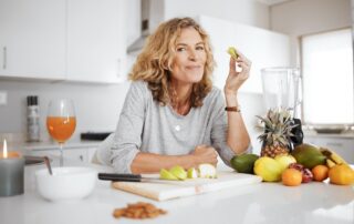 A woman enjoy fruit for breakfast