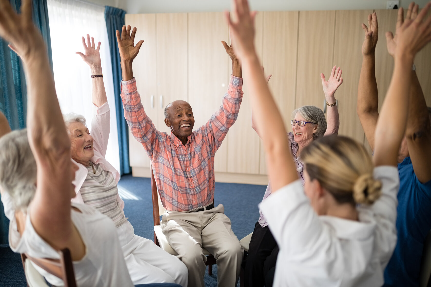 Cheerful group in dementia senior living.