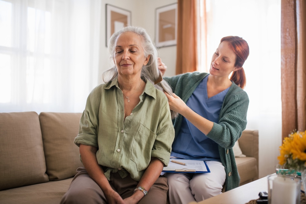 Senior woman receiving care from dementia senior living 